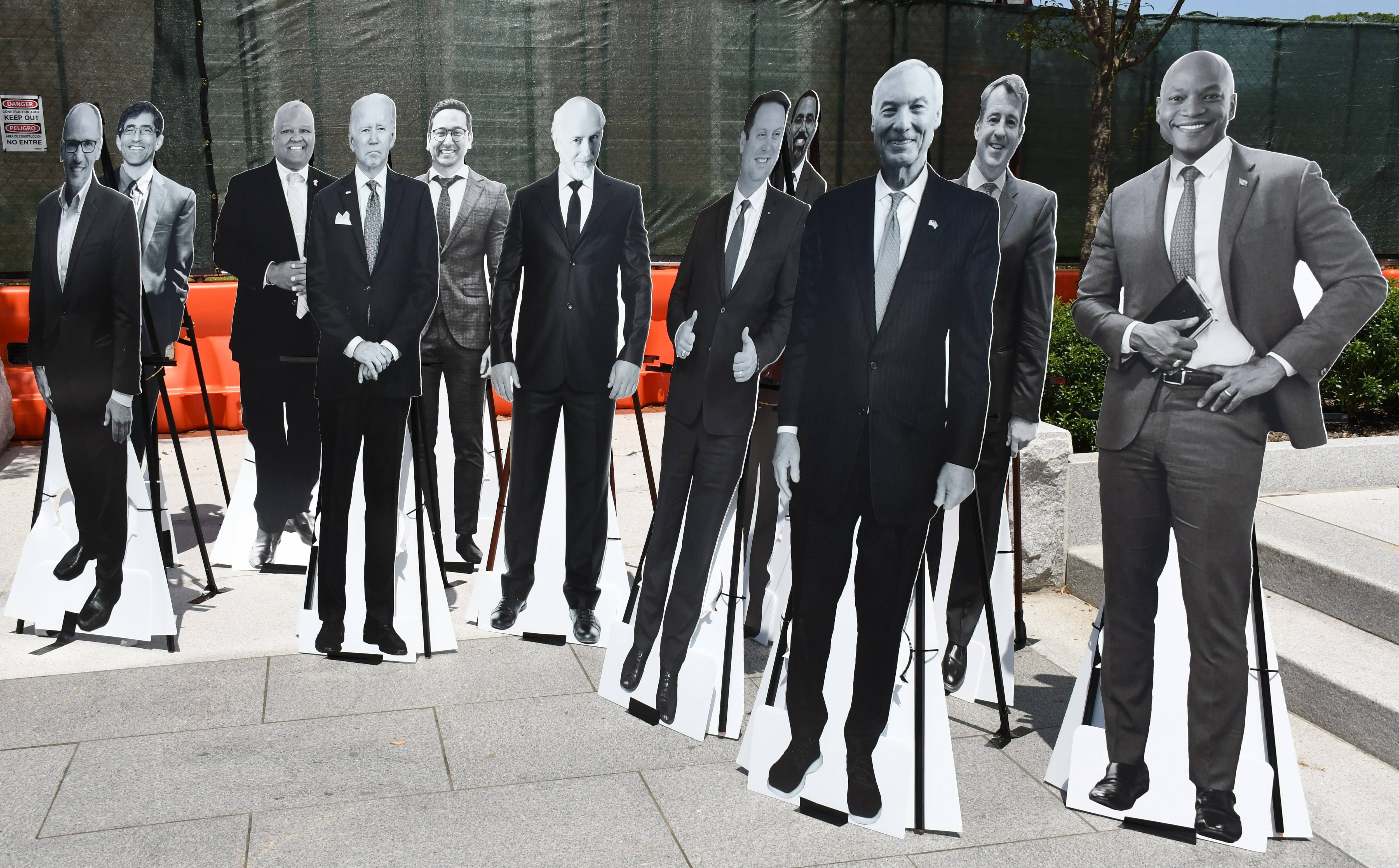 Cardboard cutouts of several candidates for governor -- plus President Joe Biden -- are put on display by Kelly Schulz's campaign team for an event at Lawyers Mall in Annapolis on July 14, 2022.