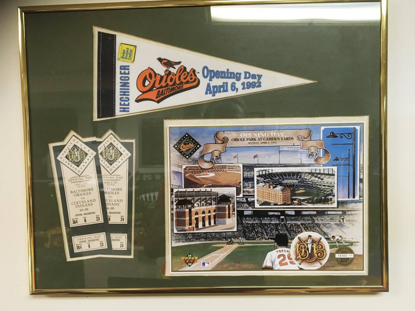A framed Orioles pennant, tickets to the opening day game on April 6, 1992 and a print of an opening day poster.