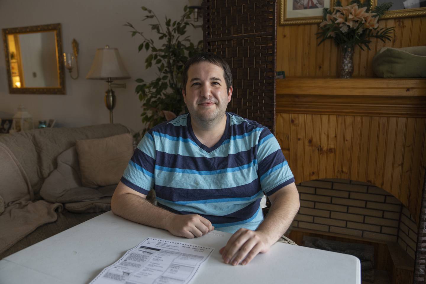Nick Frisone sits at his home after receiving his long lost 2020 ballot. Along with Nick, numerous neighbors on his block recieved their 2020 ballots 2 years late.