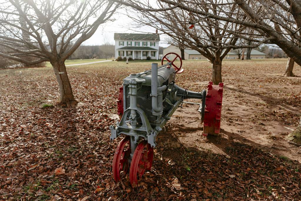 An antique tractor by the road marks the driveway to the Howard County Living Farm Heritage Museum, on Monday, Dec. 4, 2023, in West Friendship. The museum will hold its final auction at the site on Saturday, April 20, 2024.