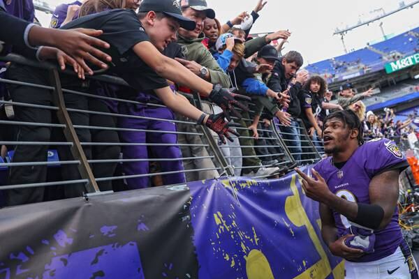 As contract saga drags on, Lamar Jackson’s backers say ‘Pay the man’