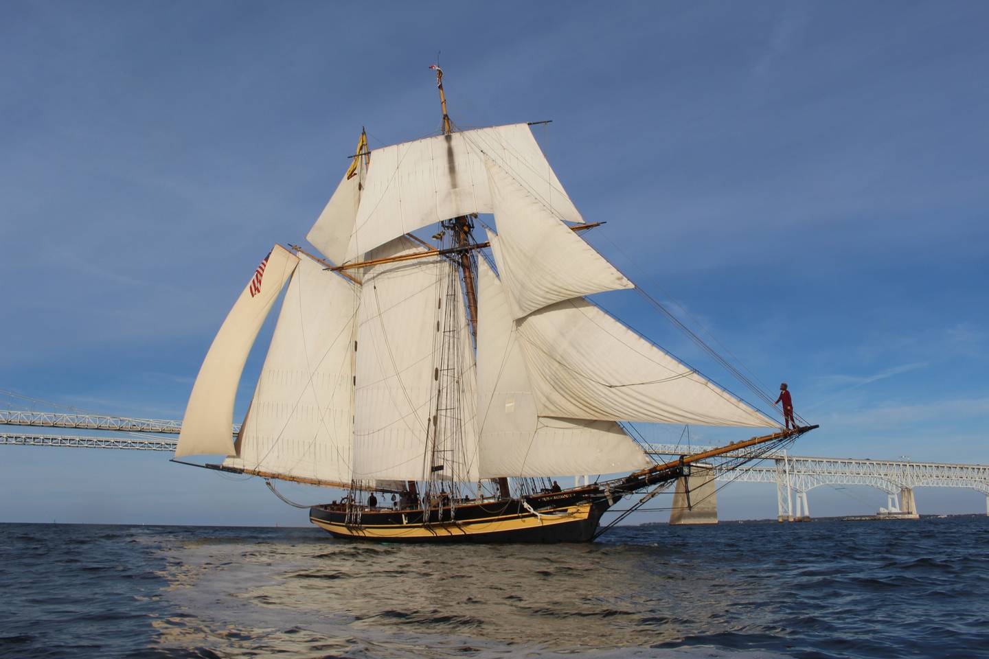 The Pride of Baltimore II, a replica clipper built in 1988, sails past the Chesapeake Bay Bridge.