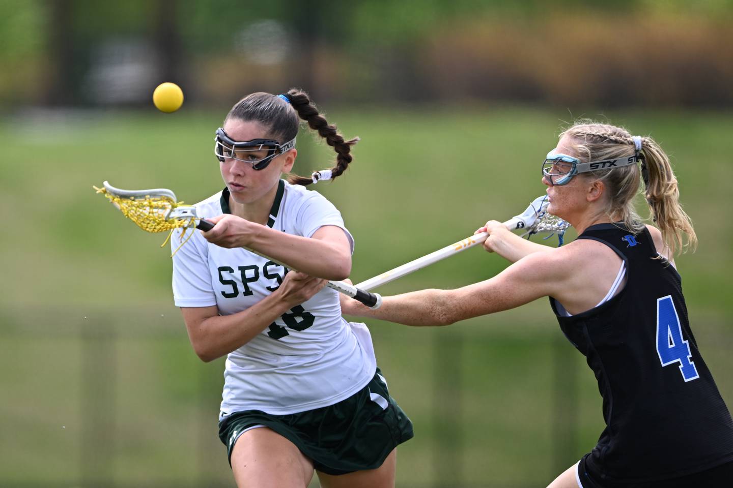 St. Pauls’ Julia Lee and Darien’s Kelly Holmes attack a loose ball in the first half of a lacrosse game Saturday, April 15, 2023, in Sparks Glencoe, MD.