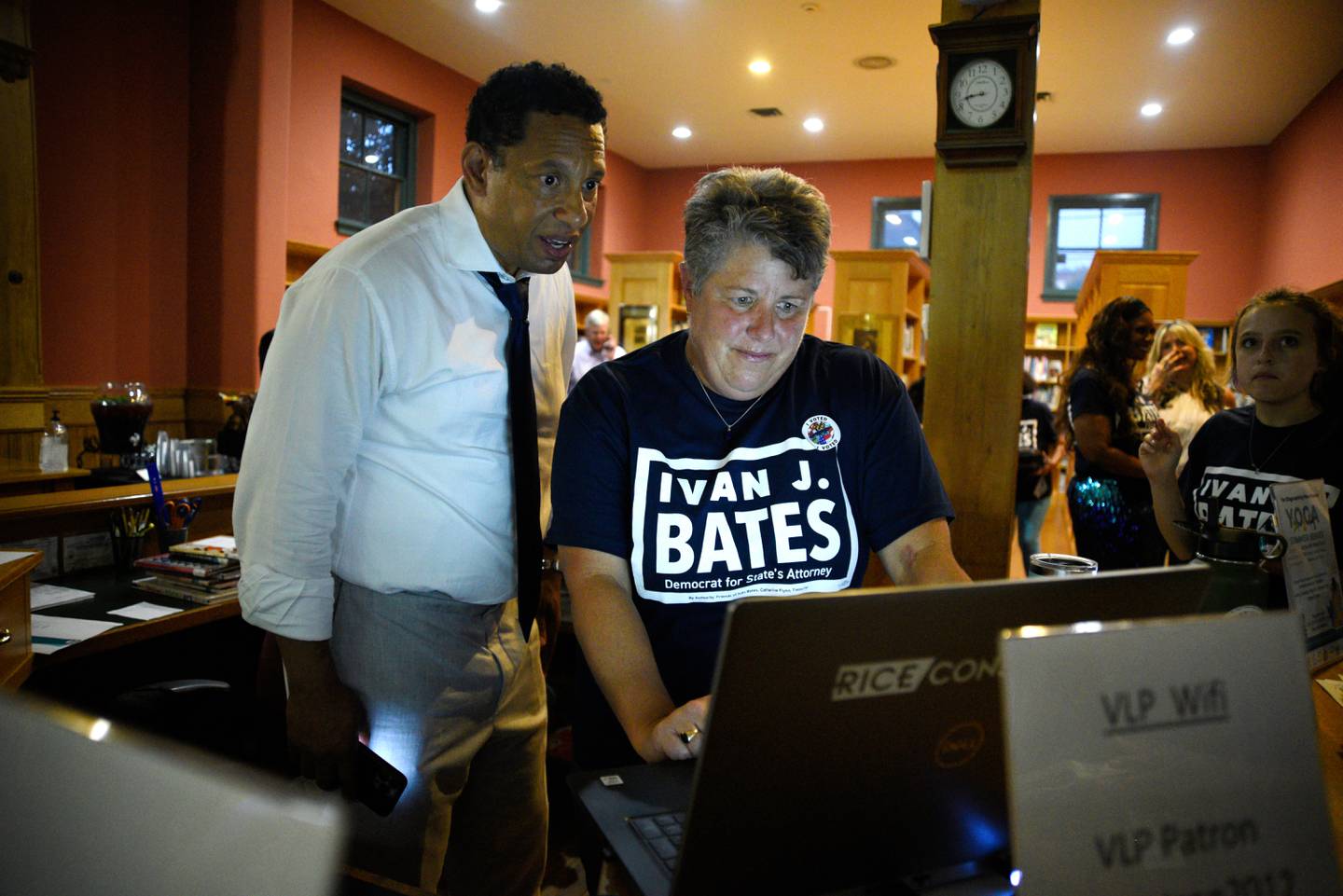 Baltimore City State's Attorney candidate Ivan Bates (left) and Rachael Rice (right) watch results come in at Bates' election night event. Maryland held its primary election on Tuesday, July 19.