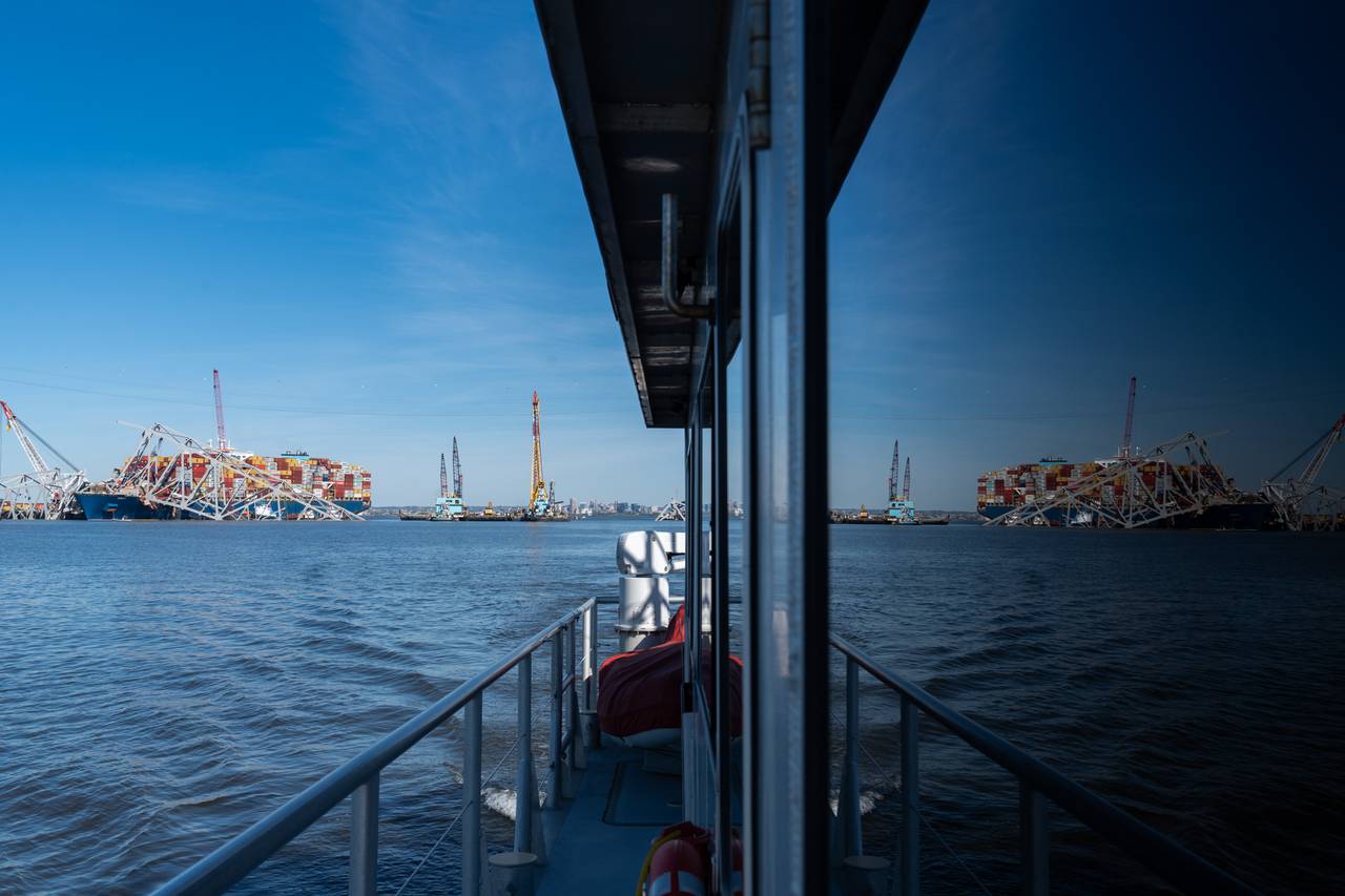 The Dali and collapsed Key Bridge are seen reflected in the windows of the Catlett, a debris survey boat, on Tuesday, April 16, 2024.