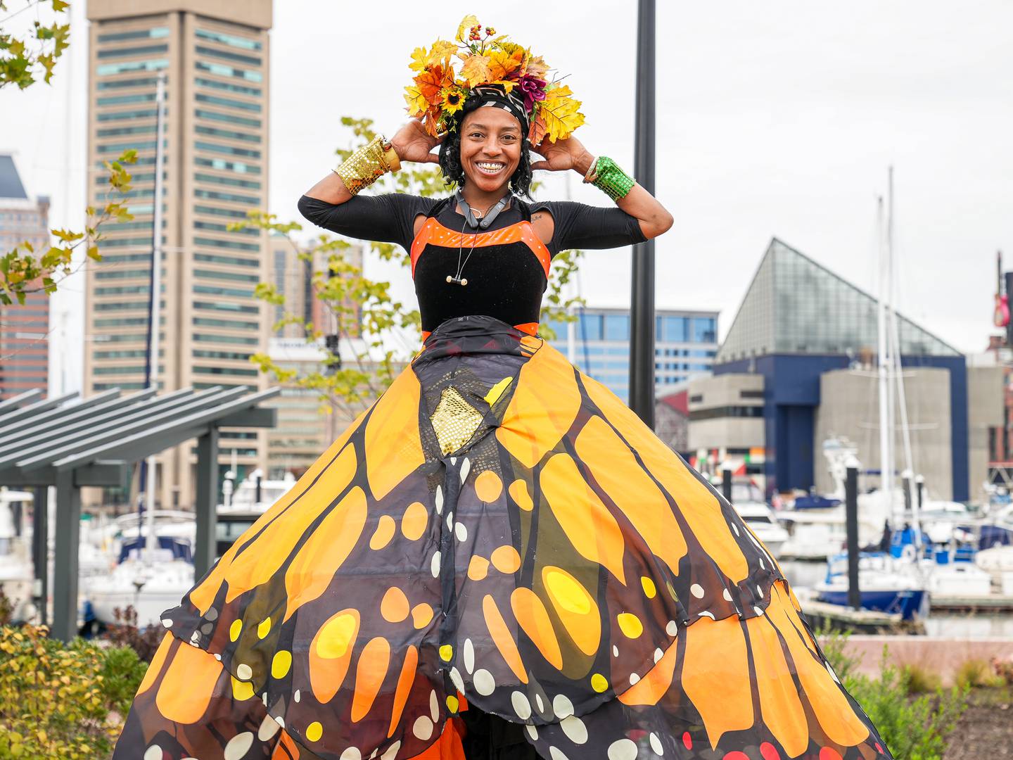 Stilt Walker Danielle Spalding, (39), poses for a photo at the Harbor Harvest Festival in Downtown Baltimore.