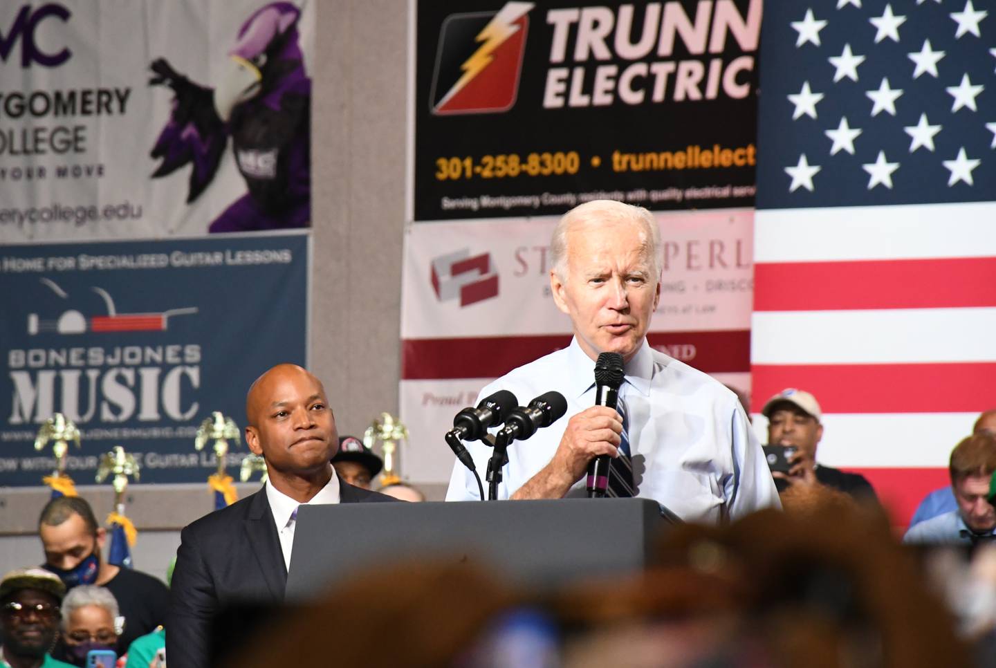 President Joe Biden speaks at a Democratic National Committee rally at Richard Montgomery High School in Rockville on Aug. 25, 2022, with Democratic gubernatorial nominee Wes Moore watching.