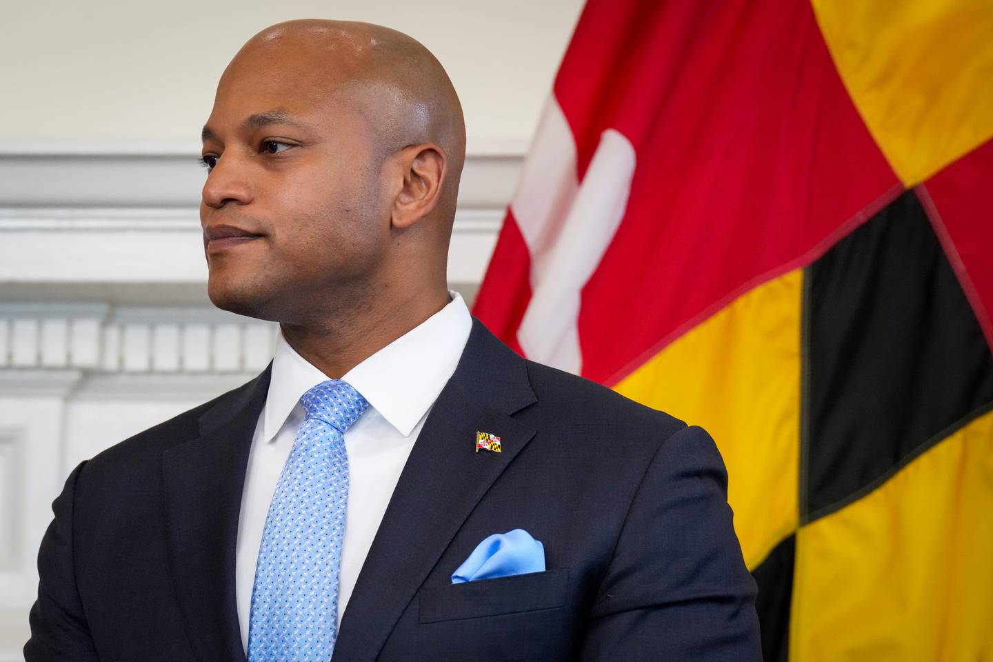 Gov. Wes Moore listens as Paul Monteiro, his pick for Secretary of the Department of Service and Civic Innovation, address the room at a press conference in the Maryland State House.on Monday, April 3. Moore issued an executive order creating the cabinet-level department on his first full day in office in January.
