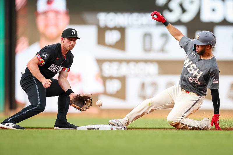 WASHINGTON, DC - MAY 07: Luis García Jr. #2 of the Washington Nationals steals second base in front of Jordan Westburg #11 of the Baltimore Orioles during the first inning at Nationals Park on May 7, 2024 in Washington, DC. (Photo by Scott Taetsch/Getty Images)