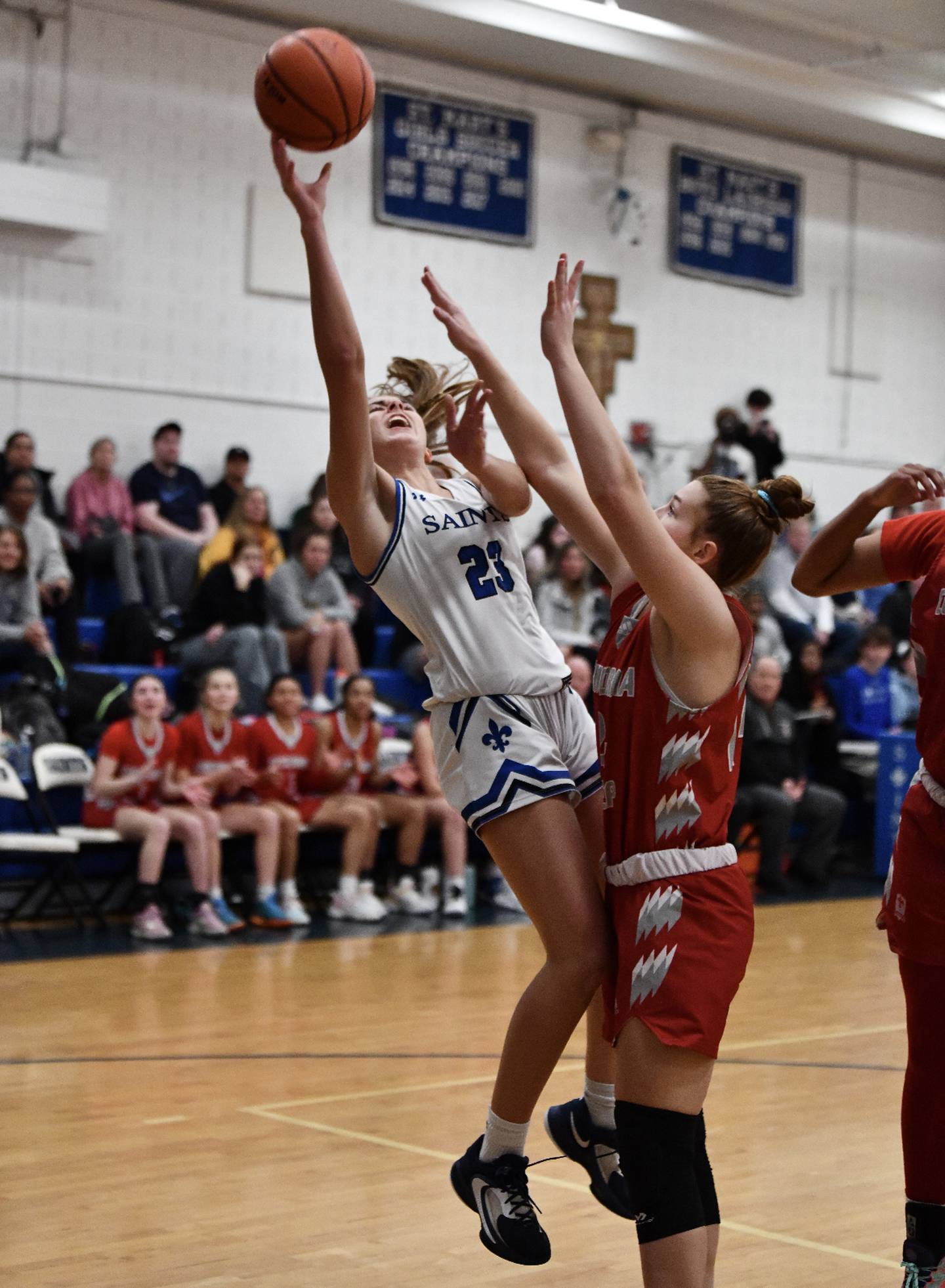 St. Mary's Bailey Harris puts up a shot as Concordia Prep's Hailee Ford defends during Wednesday's IAAM B Conference girls basketball contest. The No. 9 Saints gained sole possession of first place in the IAAM B with a 46-39 victory in Annapolis.