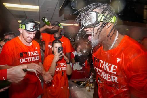Baltimore Orioles shortstop Jorge Mateo is doused in champagne and beer in the team clubhouse following a win against the Tampa Bay Rays at Camden Yards on Sunday, September 17, 2023. The Baltimore Orioles clinched a spot in the postseason for the first time since 2016.
