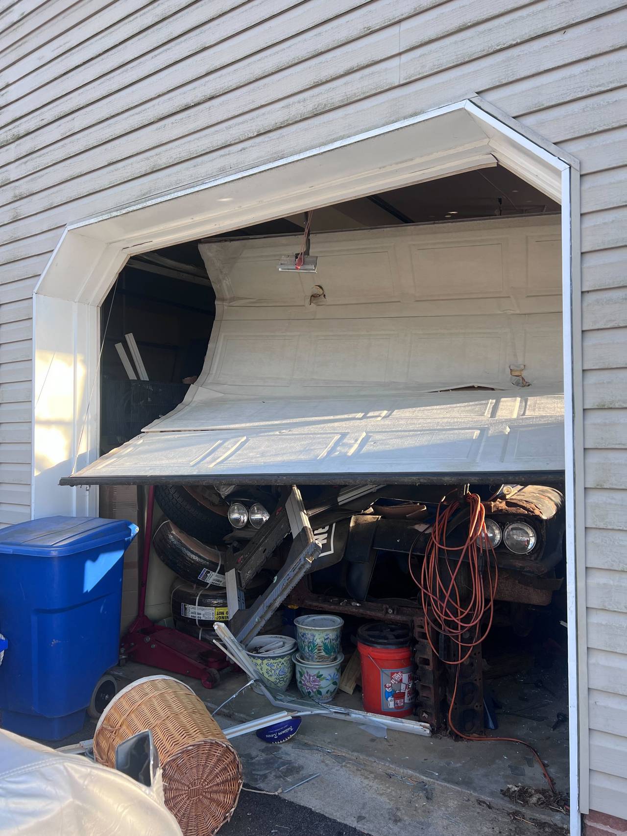 The bent garage door at the Cockeysville home of David Linthicum on Friday, Feb. 10.