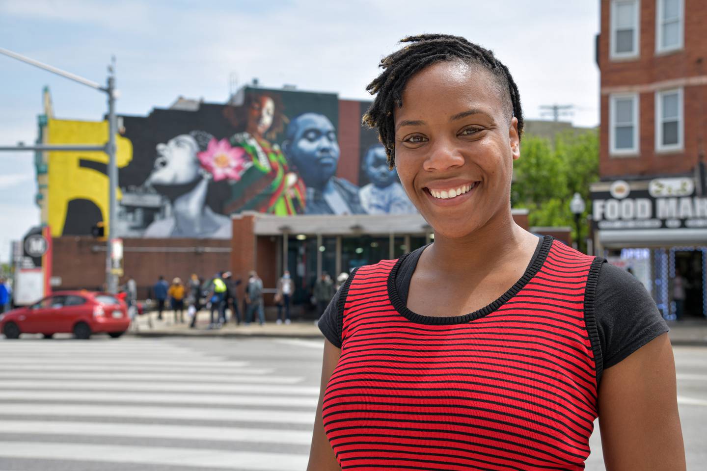 Baltimore Banner reporter Jasmine Vaughn-Hall stands for a portrait by Penn-North station.