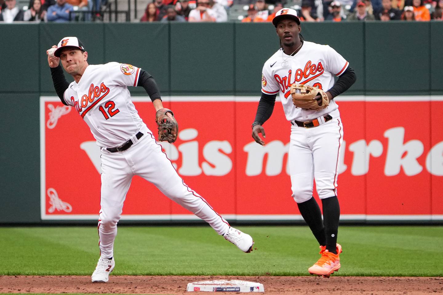 Baltimore Orioles second baseman Adam Frazier (12), next to shortstop Jorge Mateo (3), fields the ball in the second inning of a baseball game against the New York Yankees on Friday, April 7. The Orioles hosted the Yankees for their Home Opener at Camden Yards.
