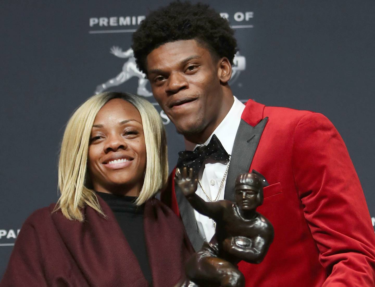 NEW YORK, NY - DECEMBER 10:  Lamar Jackson of the Louisville Cardinals poses for a photo with his mother, Felicia Jones, after being named the 82nd Heisman Memorial Trophy Award winner during the 2016 Heisman Trophy Presentation at the Marriott Marquis on December 10, 2016 in New York City.