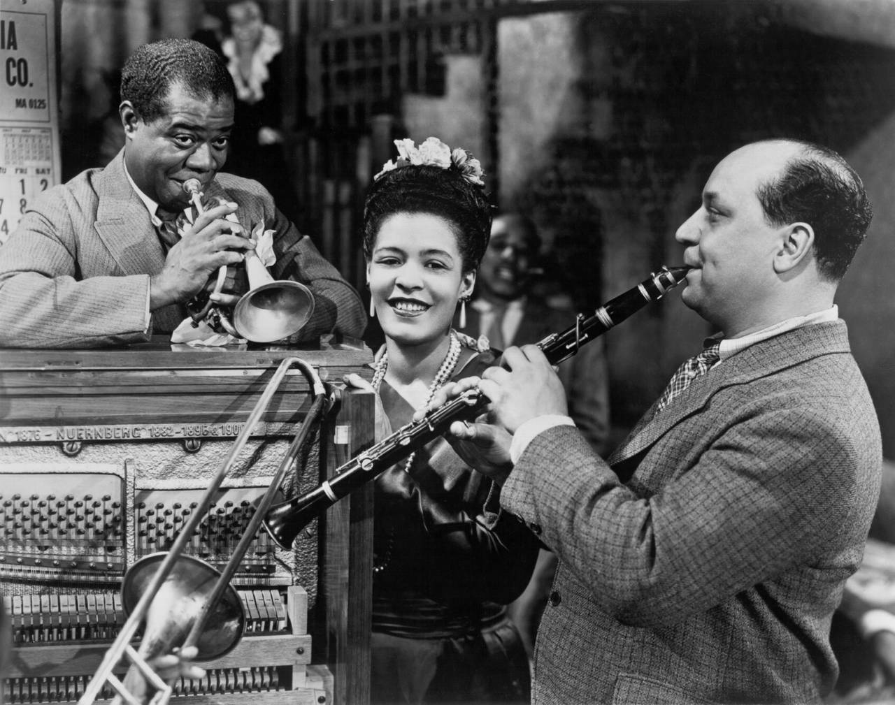 NEW ORLEANS - 1947:  Louis Armstrong (left), Billie Holiday (middle) and Barney Bigard (right) perform on the set of the musical "New Orleans" in 1947 in New Orleans, Louisiana. Billie Holiday  Photo by Michael Ochs Archives/Getty Images