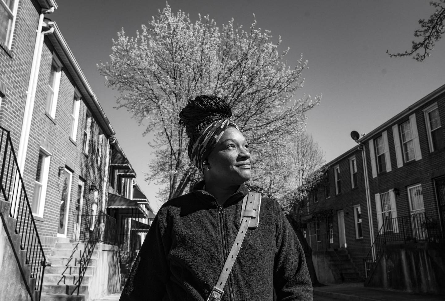 Nakitah Holland stops for a portrait in the corridors along U.S. Route 40 in Baltimore, Wednesday, March 8, 2023. Holland said her grandmother's house was within a few blocks of the highway and she always cherished how much green space it had. If repurposed, she'd like to see more grass in the highway's footprint, but beyond that, she's not sure what else the city could do with it.