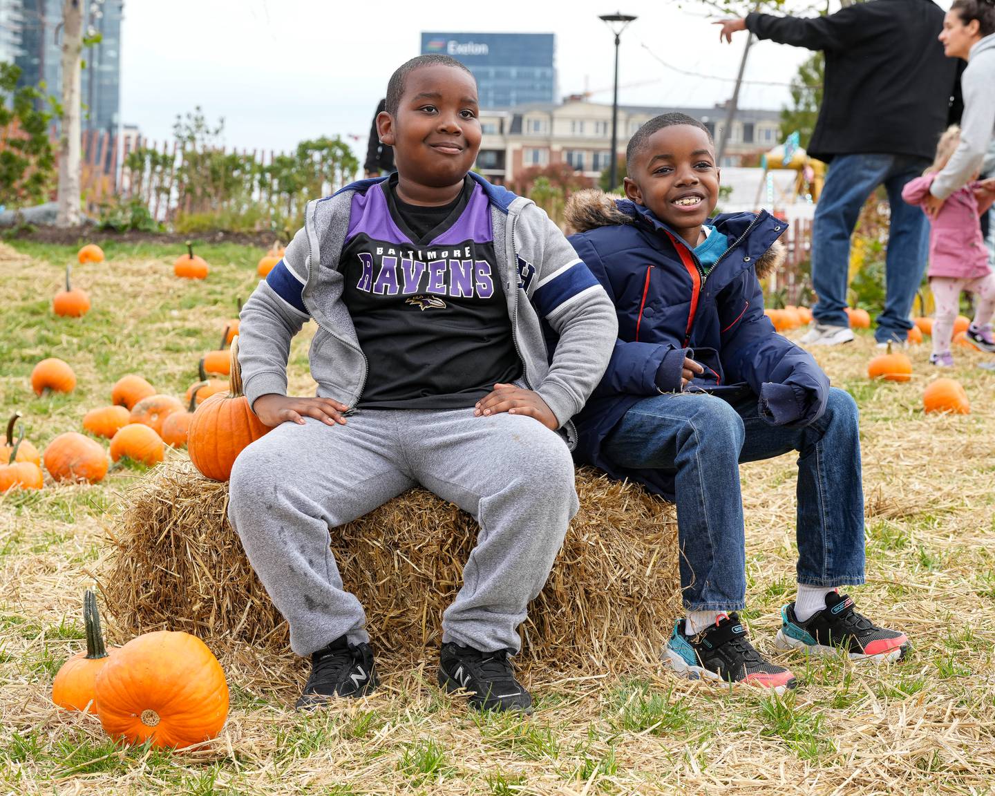 At the Harbor Harvest  Festival two children pose for their parents at this pop-up pumpkin patch in the Inner Harbor. In true kid fashion, this young Ravens fan was much more excited about posing in his shirt, than with any pumpkin.