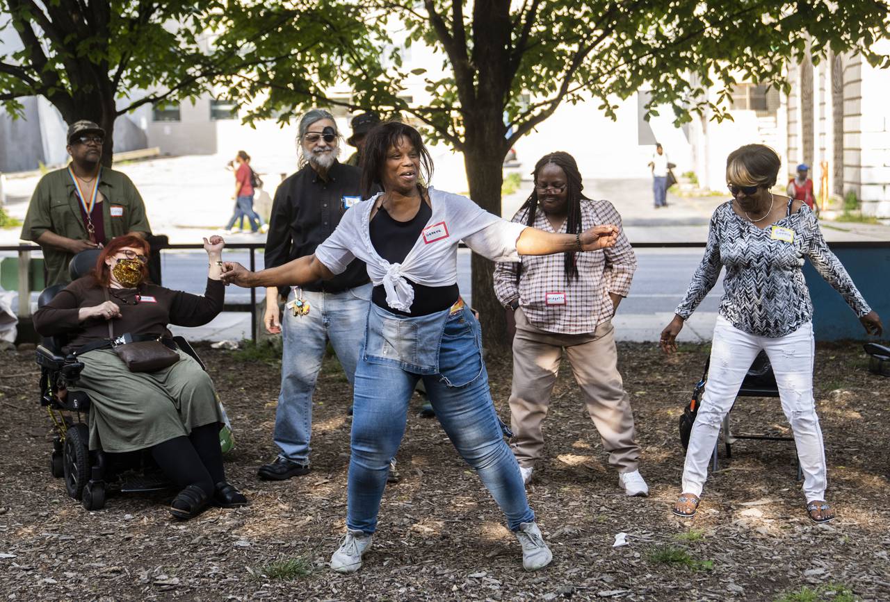 Geneva Parrish preforms a dance with other members of the Good Trouble Church, during Family Life at the YNot Lot in Baltimore, May 11, 2023.
