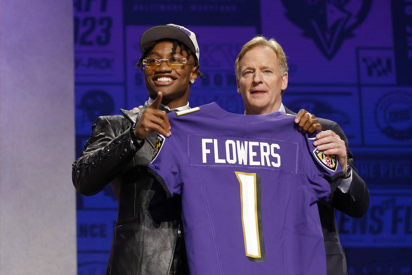 Zay Flowers poses with NFL Commissioner Roger Goodell after being selected 22nd overall by the Baltimore Ravens during the first round of the 2023 NFL Draft at Union Station on April 27, 2023 in Kansas City, Missouri.