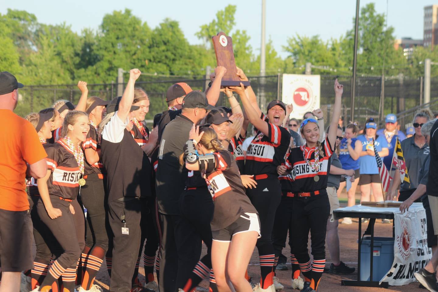 Rising Sun senior Cadence Williams help hoist the Class 2A state softball championship game Friday. The fourth-ranked Tigers won their first state title since 2003 with a 1-0 extra inning victory over Calvert at the University of Maryland.