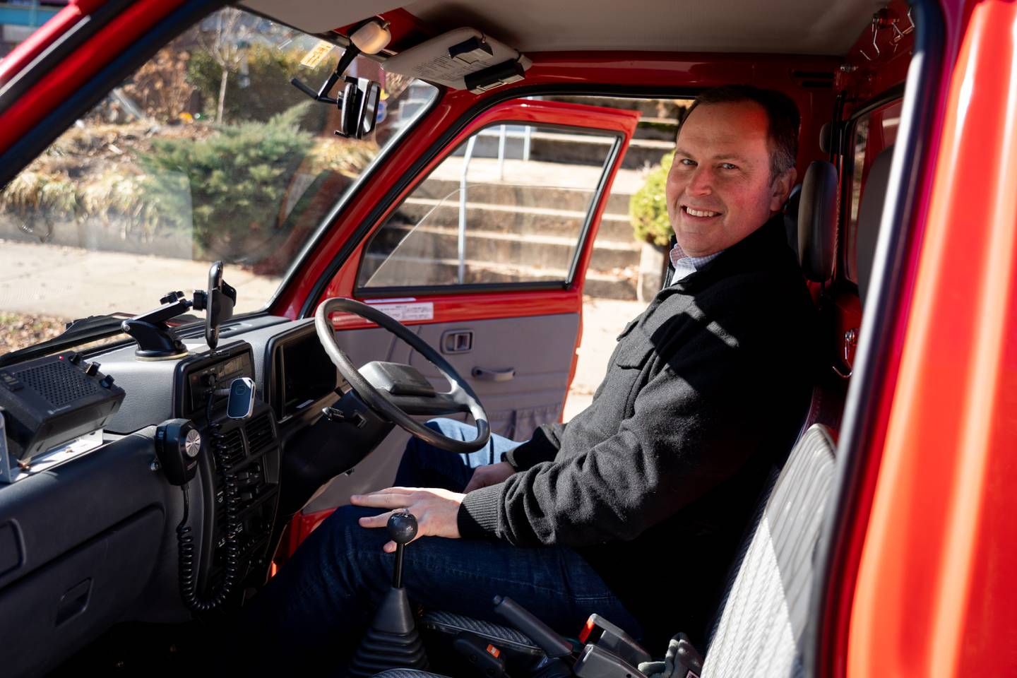 Brett Rogers with Yama, his 30-year-old Japanese firetruck, in Charles Village on January 24, 2023.