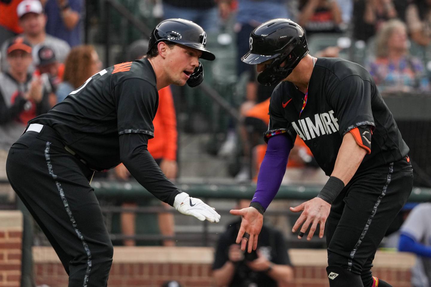 Baltimore Orioles left fielder Austin Hays (21) celebrates with catcher Adley Rutschman (35) after homering in a baseball game against the Kansas City Royals at Camden Yards on Friday, June 9, 2023.