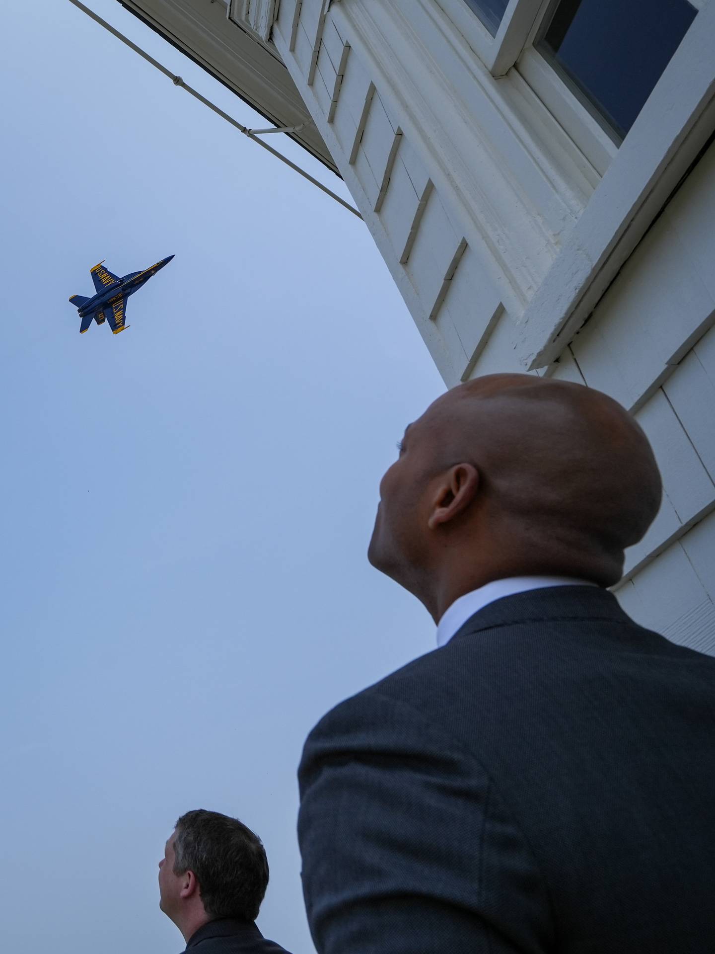 Gov. Wes Moore watches a performance by the U.S. Navy Blue Angels from the top of the State House on May 24, 2023. The show is part of a series of events during the Naval Academy’s Commissioning Week, all leading up to the graduation ceremony on Friday morning.