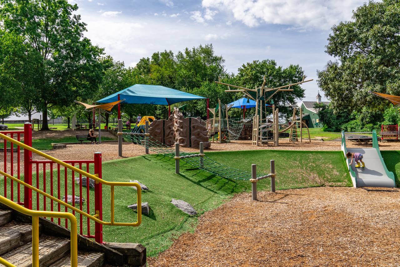 A wide view of Kinder Farm Park Playground as seen from the bottom tier.