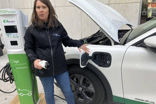 Stephanie Leach with BGE demonstrates EV charging at an event at State Center in Baltimore.