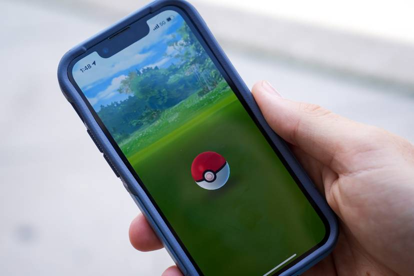 Baltimore Banner reporter Cody Boteler plays Pokémon Go on The Avenue in Hampden on 8/19/22. The mobile game has been popular since its launch in 2016.
