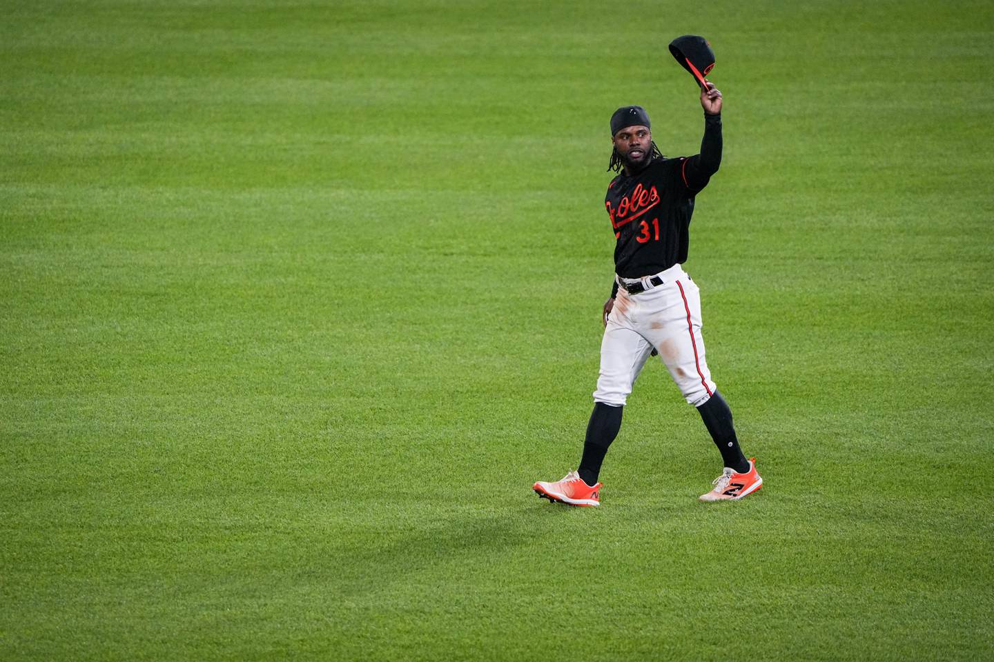 Baltimore Orioles center fielder Cedric Mullins tips his hat to the audience after successfully hitting for the cycle in a game against the Pittsburgh Pirates at Camden Yards on Friday, May 12. The Orioles won the first game of the 3-game series, 6-3.