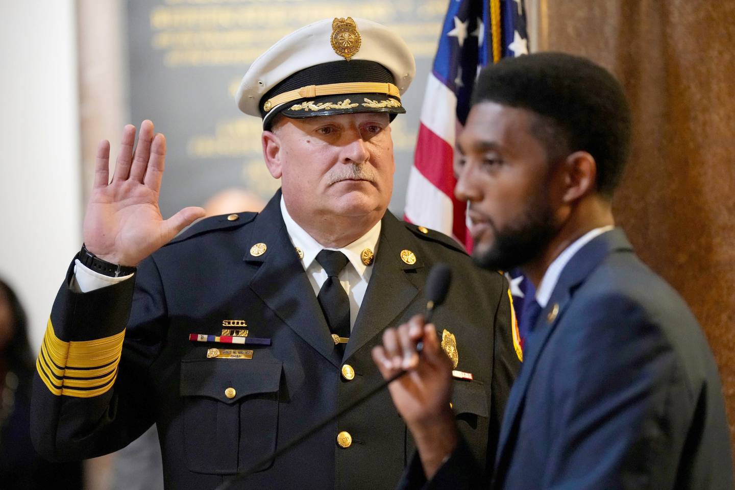 Baltimore Fire Chief James Wallace is officially sworn into office by Mayor Brandon Scott during a ceremony at City Hall on Thursday, October 5.
