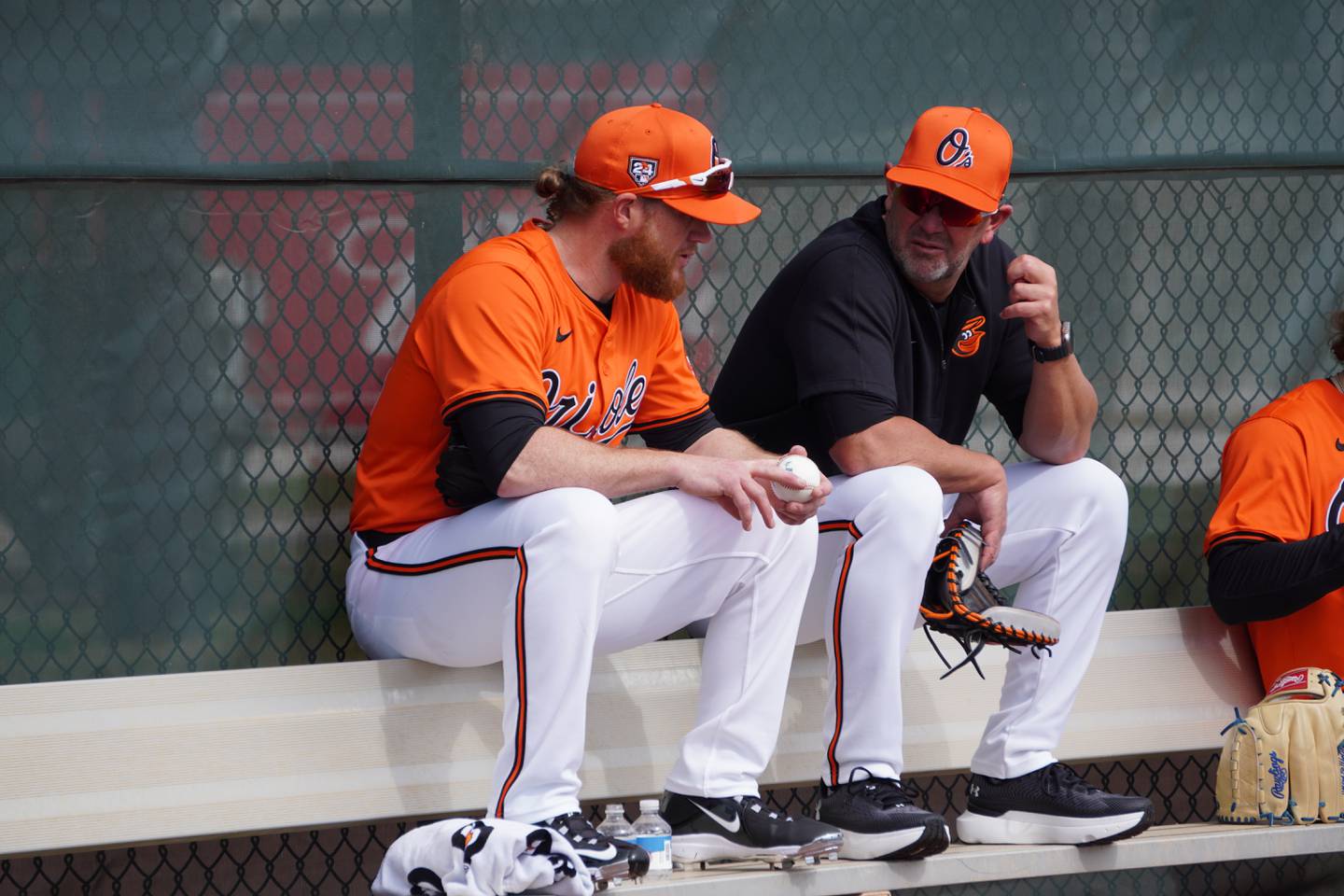 Orioles relief pitcher Craig Kimbrel speaks with manager Brandon Hyde at Spring Training in Sarasota.