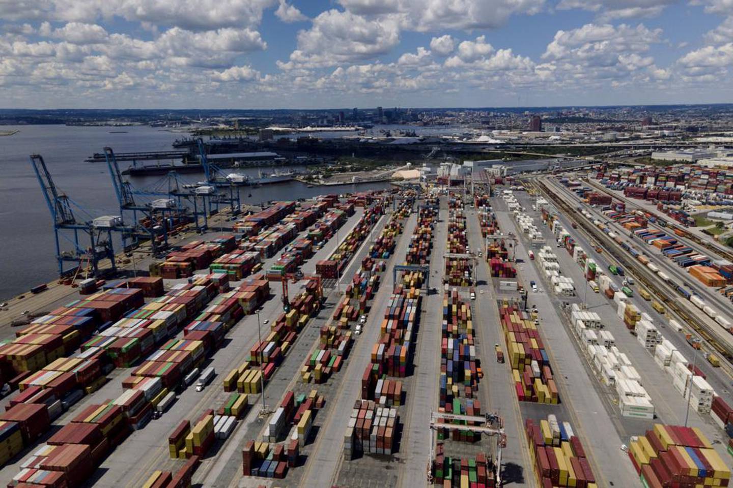 Shipping containers are stacked together at the Port of Baltimore, Friday, Aug. 12, 2022, in Baltimore. Six months into the war in Ukraine, American companies — including federal contractors — continue to buy everything from birch wood flooring to weapons-grade titanium from major Russian corporations.