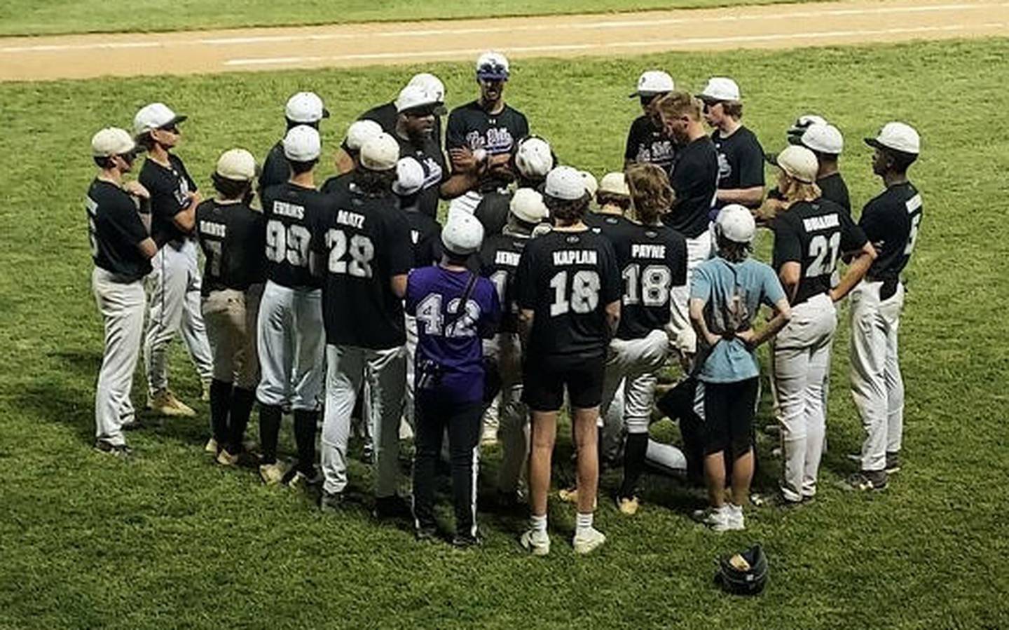 Pikesville's baseball team gather with coach Dominic Peters (middle) after Tuesday's Class 1A state semifinals. The Panthers' season concluded with a 4-1 loss to reigning state champ Clear Spring of Washington County at McCurdy Field in Frederick.