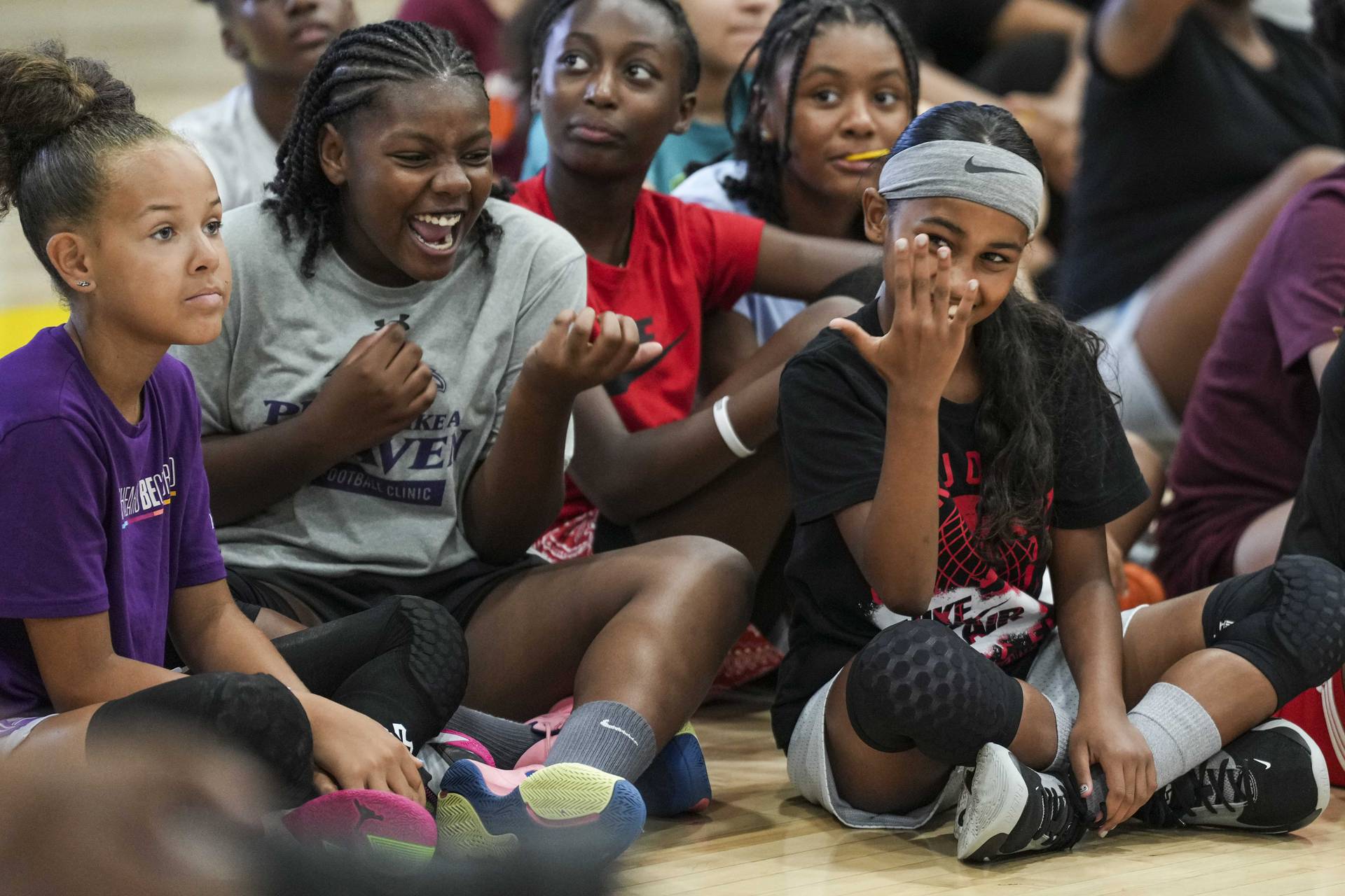 LSU basketball star and Baltimore native Angel Reese hosted a basketball clinic at Saint Frances Academy on July 19, 2023. Attendees scream, cheer and clap for Reese as she enters the court.