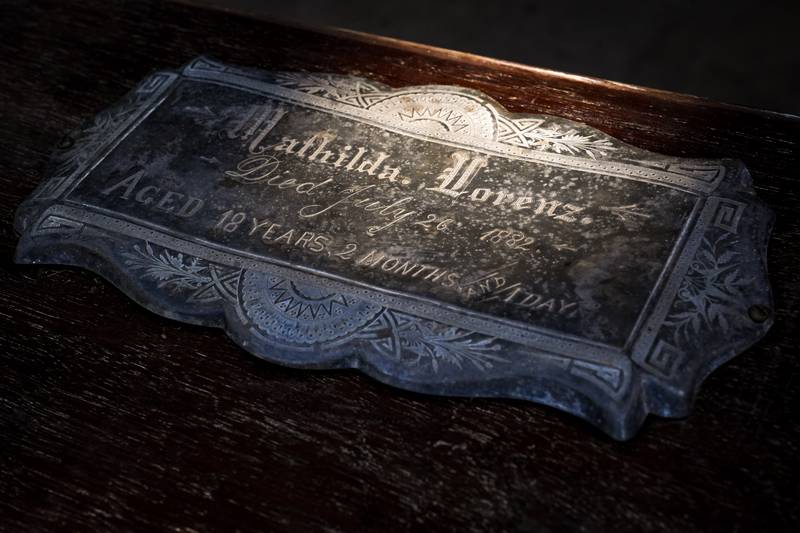 The nameplate on the outside of Mathilda Lorenz’s empty casket on July 28, 2022. The mysterious casket was originally found down by a stream in Wyman Park.