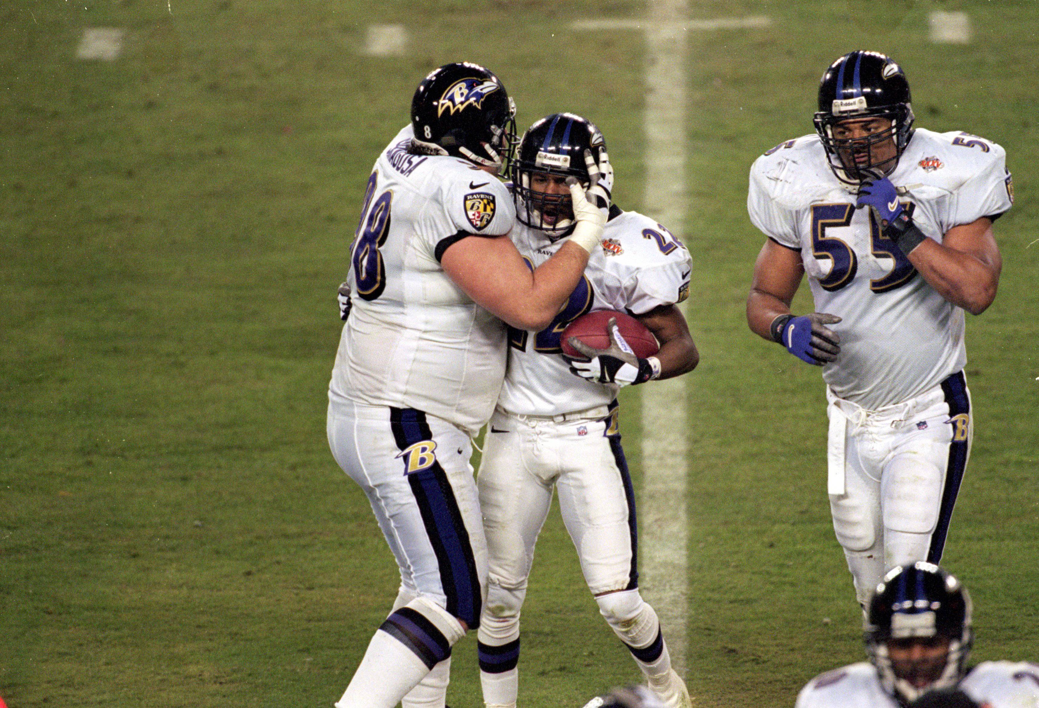 28 Jan 2001:  Duane Starks #22 of the Baltimore Ravens celebrates his interception with teammate Tony Siragusa #98 during the Super Bowl XXXV Game against the New York Giants at the Raymond James Stadium in Tampa, Florida. The Ravens defeated the Giants 34-7.