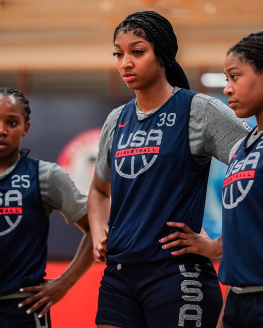 Team USA member Angel Reese listens intently to her coaches at a practice this past summer.