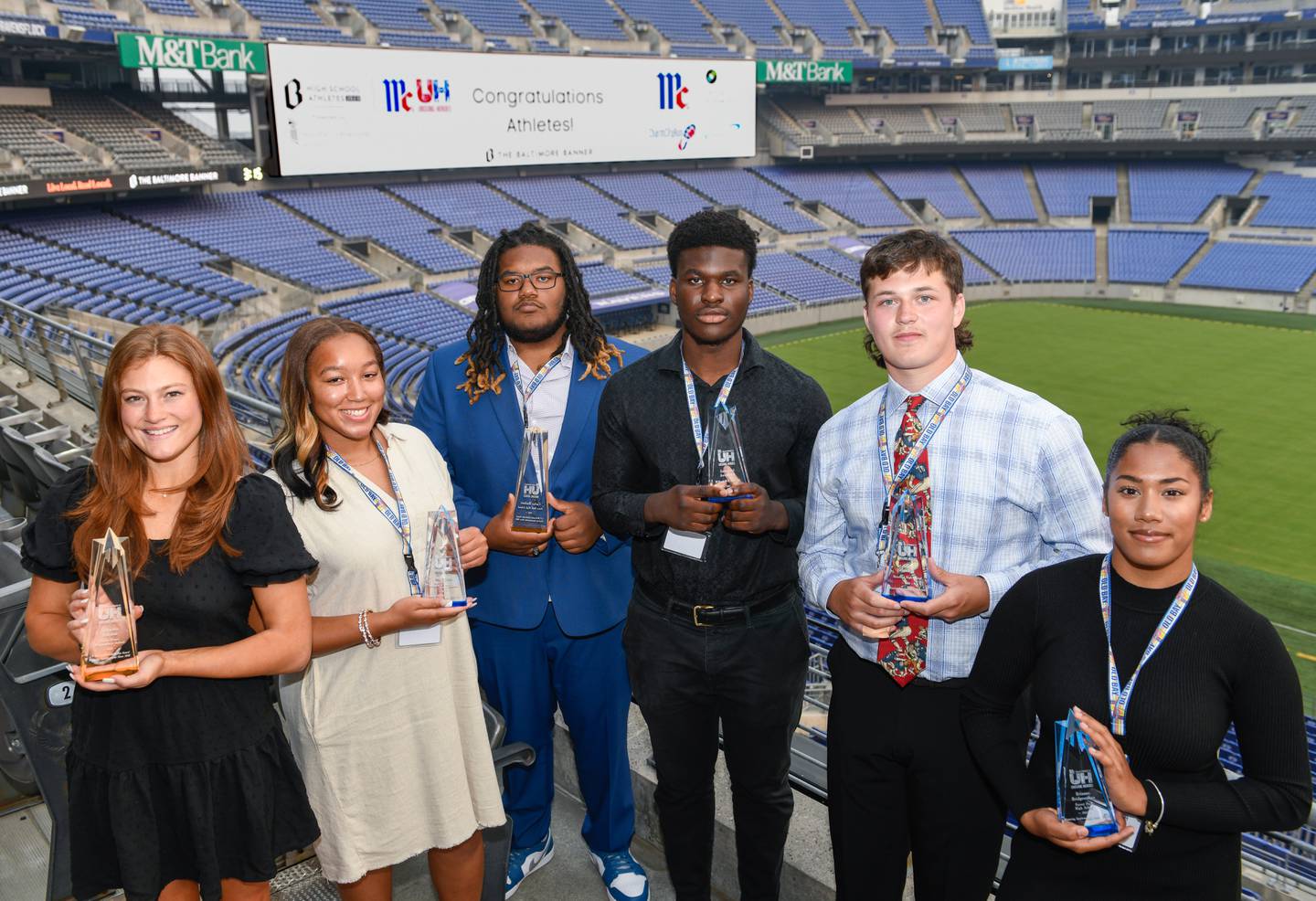McCormick Unsung Heroes awardees Georgiana Benckini, from left, of Notre Dame Prep, Imani Groce, of Western Tech, Carter Herbert, of Perry Hall, Emmanuel Awogbesan, of Milford Mill, Adam Ossakow, of Hereford, and Brianna Bridgemohan, of Forest Park, stand together at The Baltimore BannerÕs High School Athlete Awards and McCormickÕs Unsung Heroes event at M&T Bank Stadium in Baltimore, Wednesday, June 7, 2023.