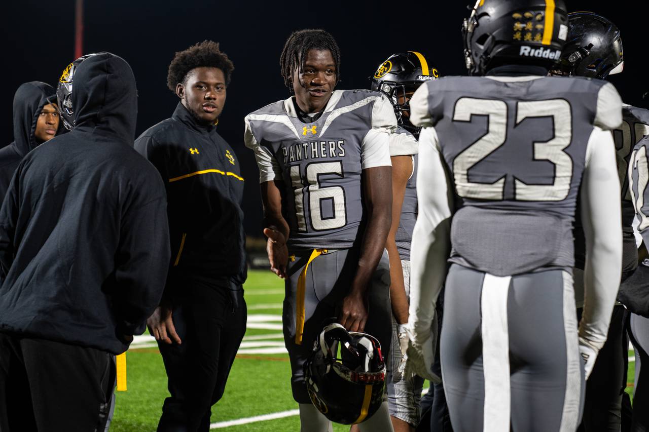 St. Frances junior wide receiver Jeremiah Koger talks with teammates during the game against National Christian Academy at Under Armour Stadium on Friday, Nov. 3, 2023.