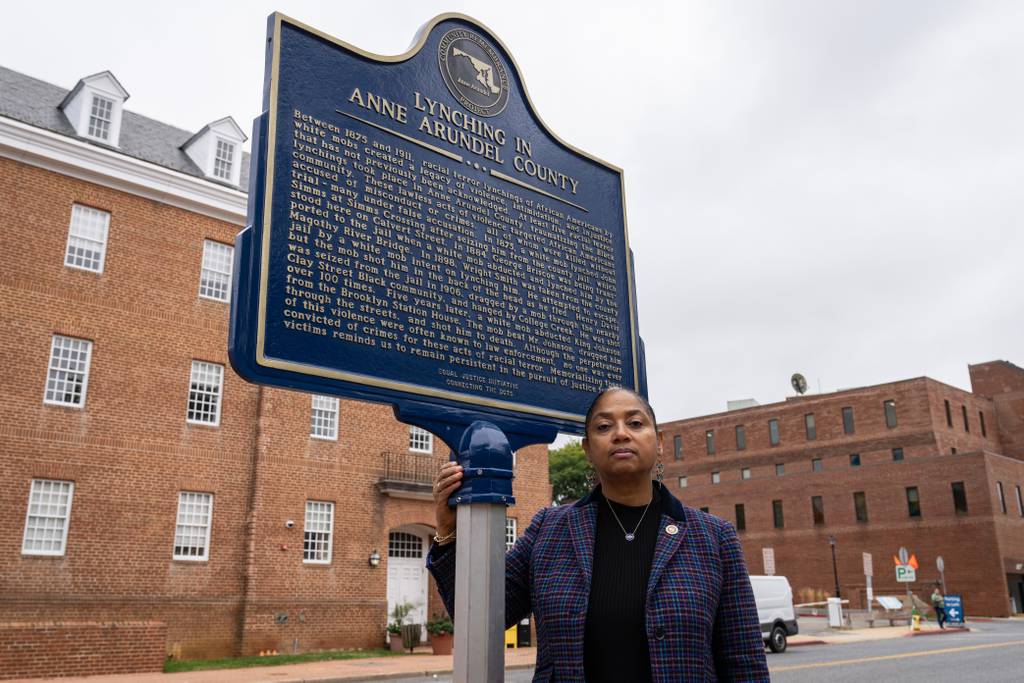 Del. Joseline Peña-Melnyk poses for a portrait in front of the lynching historical marker in Annapolis.