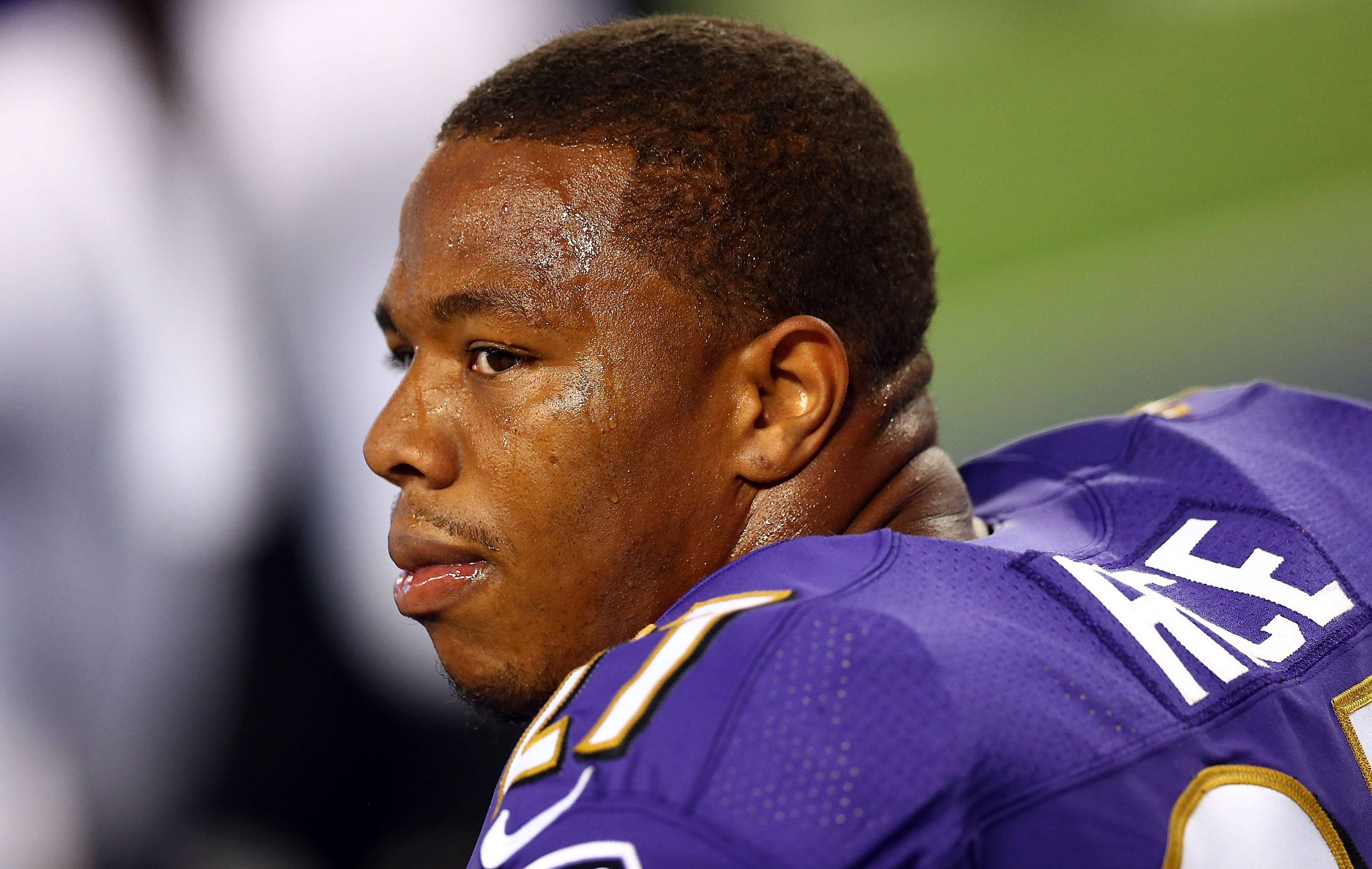 Ray Rice #27 of the Baltimore Ravens sits on the bench against the Dallas Cowboys in the first half of their preseason game at AT&T Stadium on August 16, 2014 in Arlington, Texas.