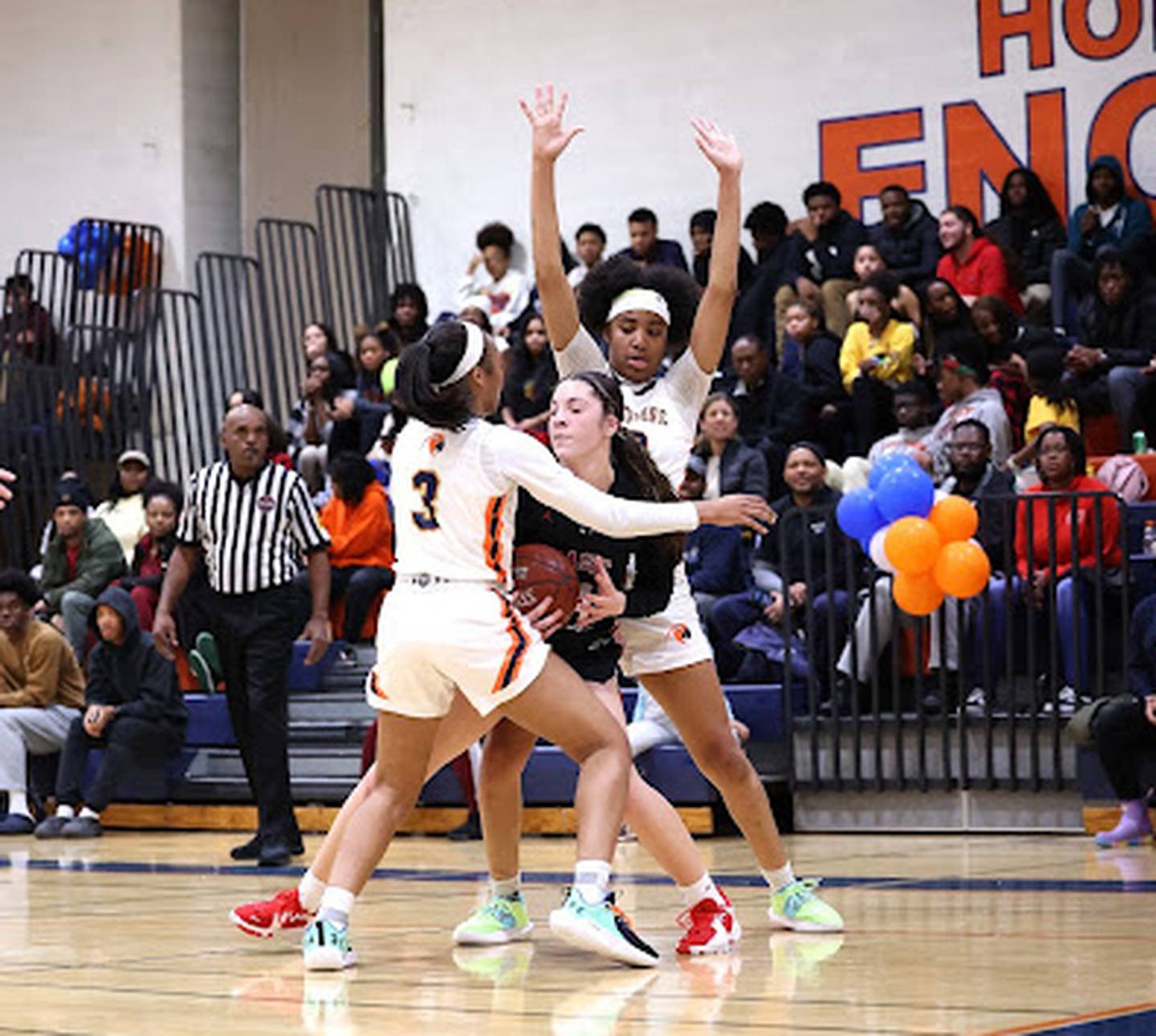 Poly's Da'Brya Clark (3) and Trinity Massenburg double-teams Mercy's Logan Jefferson during Thursday's girls basketball contest. The No. 2 Engineers held eighth-ranked Mercy to two points in the second quarter, paving the way to a 57-42 non-league victory in Northwest Baltimore.