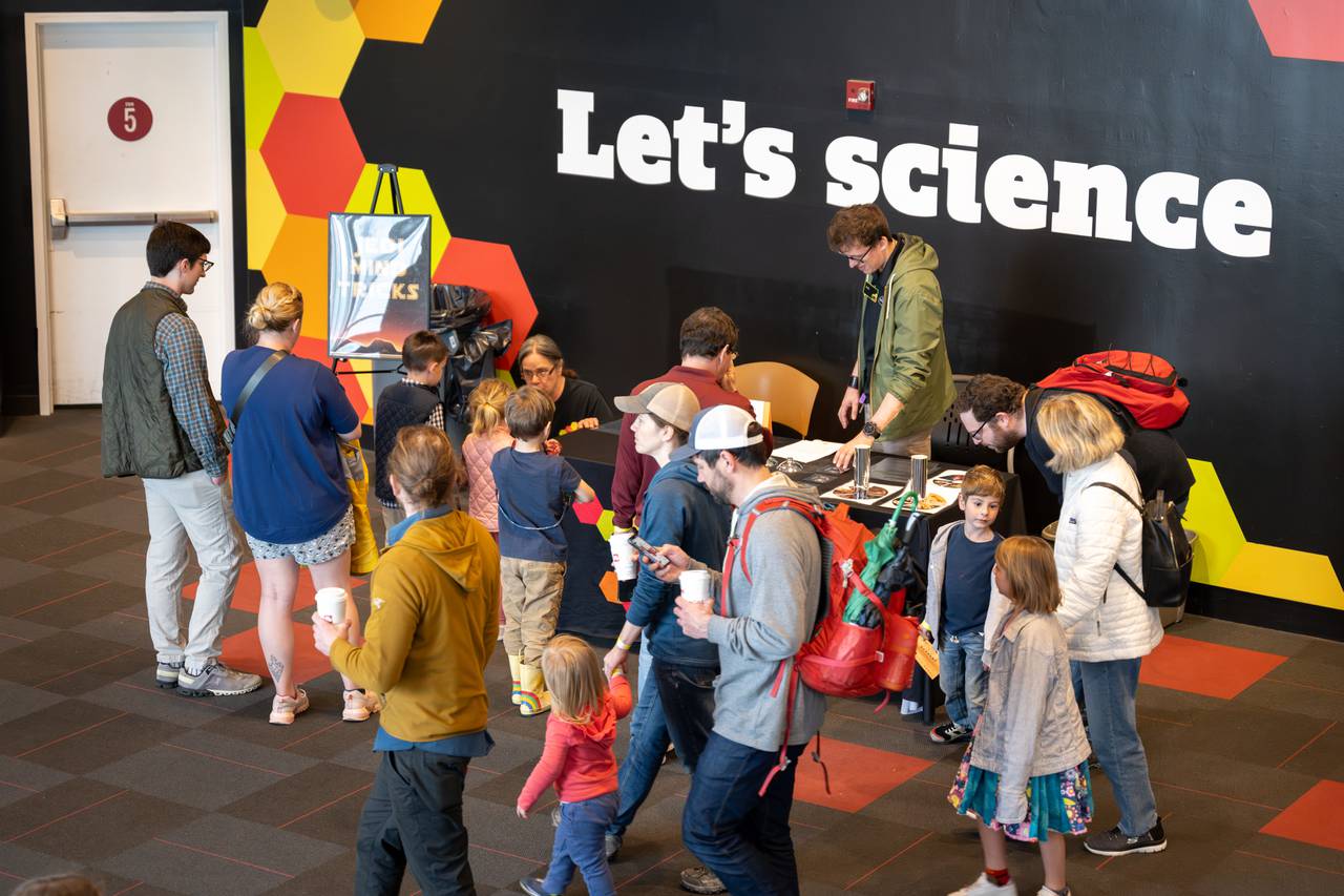 Maryland Science Center visitors gather around the Jedi Mind Trick exhibit showcasing optical illusions during the Jedi Academy event held on May 4, 2024, in Baltimore.