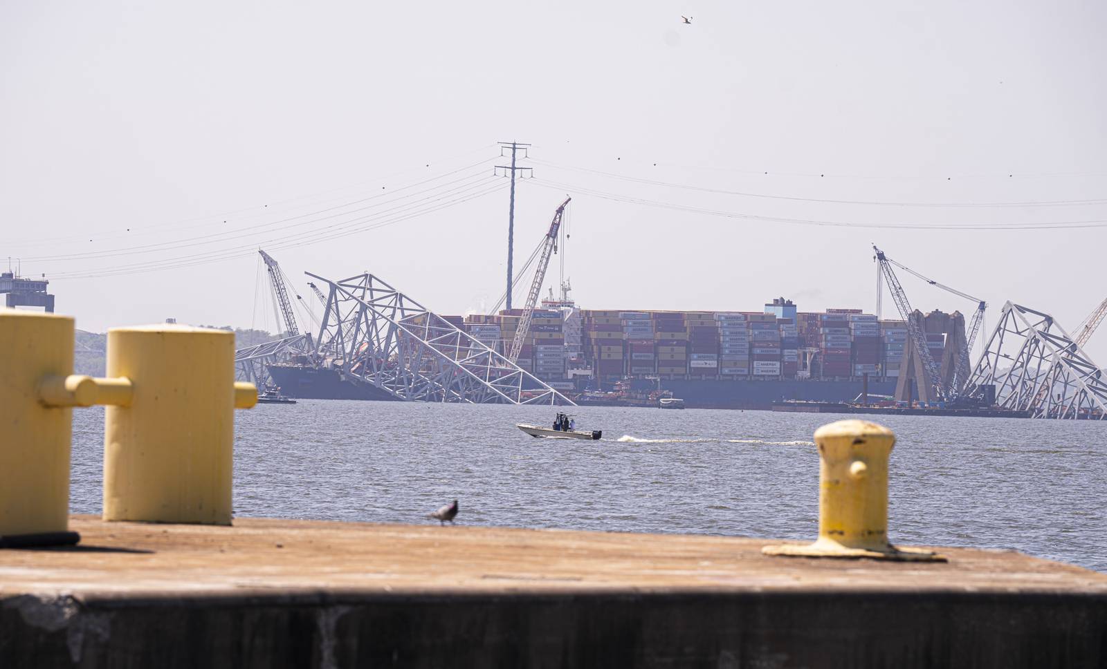 The Dali is seen from the pier on which the Chesapeake 1000 crane and the hydraulic wreck grabber sit on April 28, 2024.