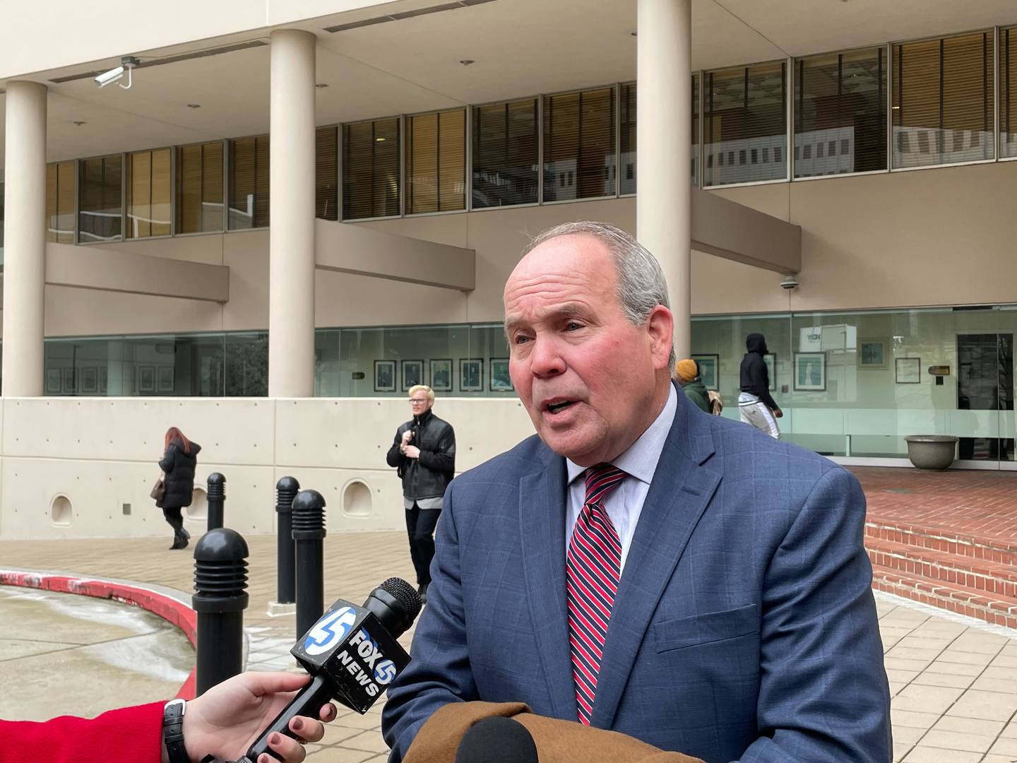 Attorney Joseph Murtha speaks to reporters outside U.S. District Court in Baltimore on Monday, March 13, 2023. He represents Roy McGrath, an ex-chief of staff to former Gov. Larry Hogan, who did not show up for his scheduled trial.