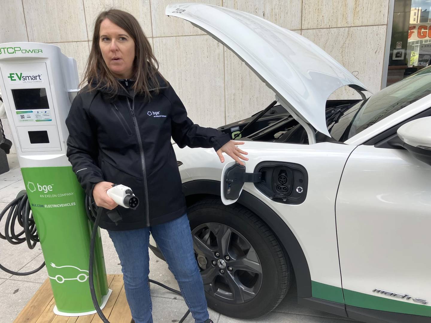 Stephanie Leach with BGE demonstrates EV charging at an event at State Center in Baltimore.