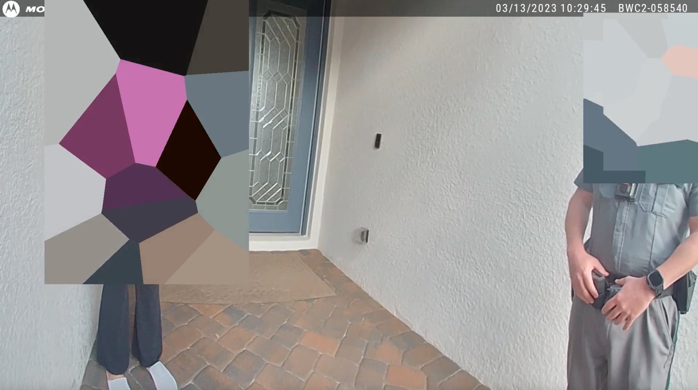 Collier County Sheriff's deputies speak with the wife of Roy McGrath at his Florida home in a still image from body camera footage recorded by a a deputy on March 13, 2023.